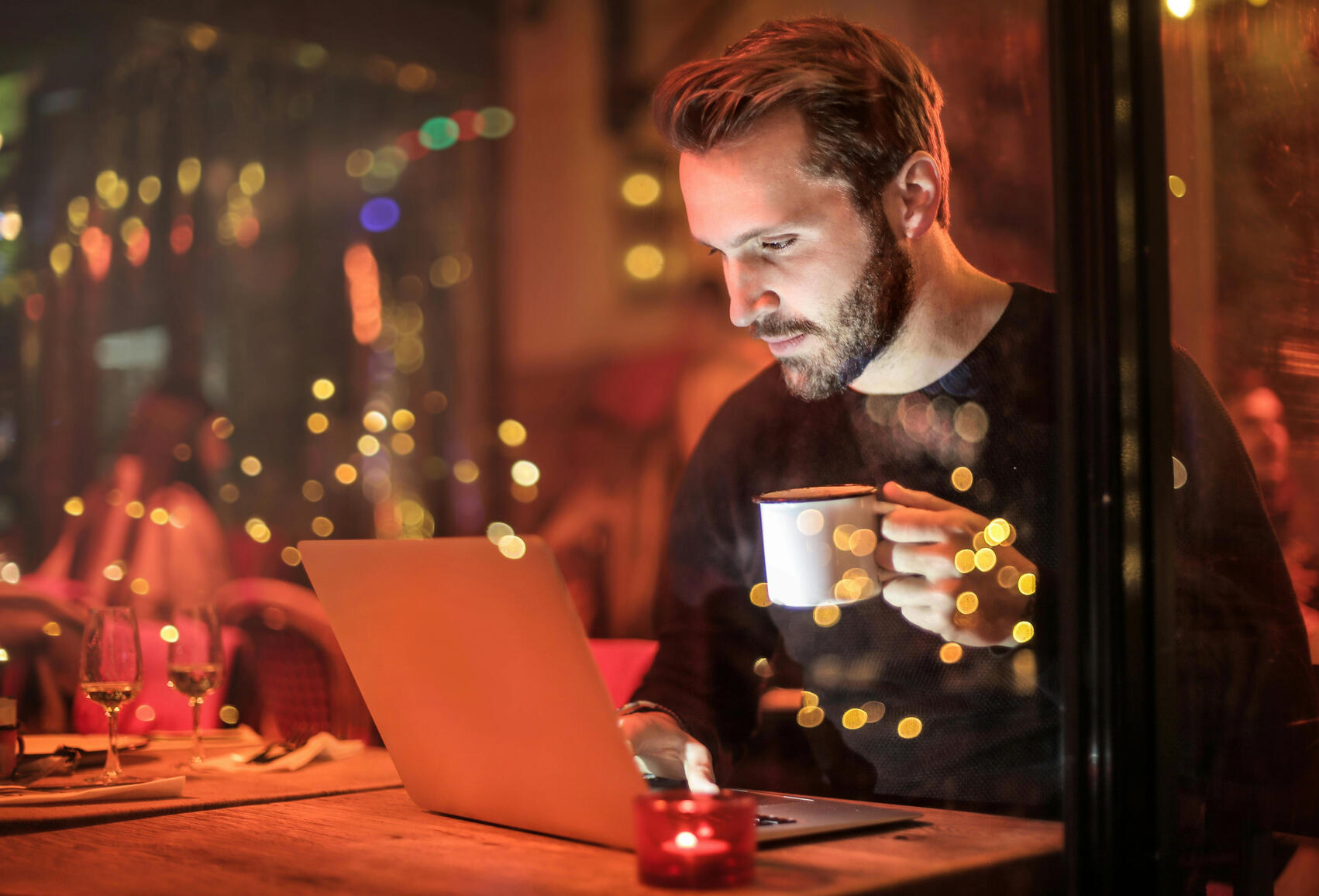 Man at coffee shop on his laptop